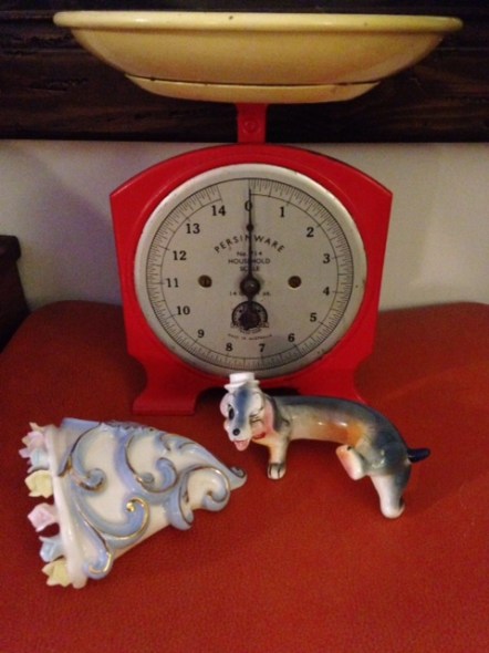 Vintage scales, kitsch dachshund, and vintage wall planter.